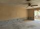 Spacious living room with ceiling fan, ready for new flooring and a modern design at 1503 12Th Se Ct # 1503, Largo, FL 33771
