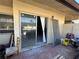 Exterior patio with sliding glass door needs improvements but offers outdoor options at 1503 12Th Se Ct # 1503, Largo, FL 33771