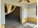 View of unfinished room with exposed walls and open doorway at 1503 12Th Se Ct # 1503, Largo, FL 33771