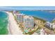 Picturesque coastal view featuring multiple high-rise condos, pristine beaches, and sparkling ocean waters at 1560 Gulf Blvd # 306, Clearwater Beach, FL 33767