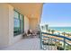Relax on this tiled balcony with seating and breathtaking beach views at 1560 Gulf Blvd # 306, Clearwater Beach, FL 33767