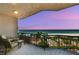 Condo balcony showing beach, palm trees, and ocean view with seating at 1560 Gulf Blvd # 306, Clearwater Beach, FL 33767
