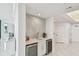 Contemporary bar area featuring custom backsplash and built-in wine storage at 1560 Gulf Blvd # 306, Clearwater Beach, FL 33767