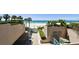A beach access area shows the beach with palm trees at 1560 Gulf Blvd # 306, Clearwater Beach, FL 33767