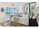 Bright bedroom with water views, modern furniture, and natural light at 1560 Gulf Blvd # 306, Clearwater Beach, FL 33767