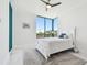 Bright bedroom with a cozy bed, large windows, and plenty of natural light at 1560 Gulf Blvd # 306, Clearwater Beach, FL 33767