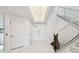 Elegant entryway boasting high ceilings, marble floors, and modern staircase at 1560 Gulf Blvd # 306, Clearwater Beach, FL 33767