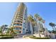 Stunning high-rise condo building featuring private balconies, lush landscaping, and a desirable coastal location at 1560 Gulf Blvd # 306, Clearwater Beach, FL 33767