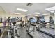 A gym with treadmills and elliptical machines with mirrors on the walls at 1560 Gulf Blvd # 306, Clearwater Beach, FL 33767