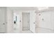 Bright hallway featuring marble floors, a residential elevator, and doors at 1560 Gulf Blvd # 306, Clearwater Beach, FL 33767