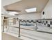 Relaxing indoor hot tub area with tiled floors and black and white accents at 1560 Gulf Blvd # 306, Clearwater Beach, FL 33767