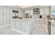 Modern kitchen with white cabinetry, stainless steel appliances, and a large center island at 1560 Gulf Blvd # 306, Clearwater Beach, FL 33767