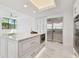 Spacious kitchen with a large center island, stainless steel appliances, and marble flooring at 1560 Gulf Blvd # 306, Clearwater Beach, FL 33767