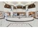Elegant lobby featuring high ceilings, columns, and a circular design with decorative railings at 1560 Gulf Blvd # 306, Clearwater Beach, FL 33767