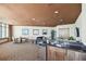 Wide angle of an entertainment and lounge area with a bar and comfortable seating at 1560 Gulf Blvd # 306, Clearwater Beach, FL 33767