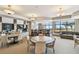 Beautiful lounge area with tables, a piano, and plenty of seating overlooking the ocean at 1560 Gulf Blvd # 306, Clearwater Beach, FL 33767