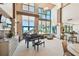 Open-concept lounge area with high ceilings, grand piano, and stunning ocean views at 1560 Gulf Blvd # 306, Clearwater Beach, FL 33767