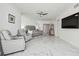 Bright main bedroom with marble floors, a ceiling fan, seating, and an entertainment center at 1560 Gulf Blvd # 306, Clearwater Beach, FL 33767
