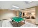 A recreation room with a ping pong table and lounge seating at 1560 Gulf Blvd # 306, Clearwater Beach, FL 33767