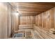 Inviting wooden sauna with tiered benches and traditional sauna stove at 1560 Gulf Blvd # 306, Clearwater Beach, FL 33767