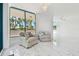 Cozy sitting area with comfortable armchairs and serene views at 1560 Gulf Blvd # 306, Clearwater Beach, FL 33767