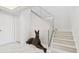 Modern staircase featuring marble steps and a glass railing, with a Great Dane statue at 1560 Gulf Blvd # 306, Clearwater Beach, FL 33767