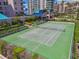 Outdoor tennis court, perfect for a sunny game with residential buildings as a backdrop at 1560 Gulf Blvd # 306, Clearwater Beach, FL 33767