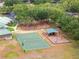 Aerial view of basketball court and shaded playground, providing fun recreational activities at 19101 Marisa Ridge Pl, Tampa, FL 33647