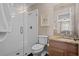 Stylish bathroom featuring a glass-enclosed shower, and granite countertops adding a touch of luxury at 19101 Marisa Ridge Pl, Tampa, FL 33647