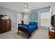 Comfortable bedroom with a ceiling fan, dresser, and serene ambiance, ideal for relaxation and rest at 19101 Marisa Ridge Pl, Tampa, FL 33647