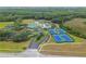 Aerial of the community clubhouse, pool, tennis courts, and meticulously maintained grounds at 19101 Marisa Ridge Pl, Tampa, FL 33647