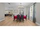 Bright dining area with modern lighting, view to the kitchen and living area, and seating for six at 19101 Marisa Ridge Pl, Tampa, FL 33647