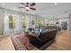 Open-concept living area with hardwood floors, living room, and kitchen in background at 19101 Marisa Ridge Pl, Tampa, FL 33647