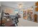 Study with built-in bookshelves and a cozy seating area, perfect for working or reading at 19101 Marisa Ridge Pl, Tampa, FL 33647