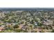 This aerial view displays a well-established neighborhood with beautiful tree coverage and diverse home styles at 2001 Pinellas Point S Dr, St Petersburg, FL 33712