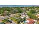 This aerial showcases the neighborhood's layout and the properties' lush landscaping in a serene setting near the water at 2001 Pinellas Point S Dr, St Petersburg, FL 33712