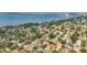 Beautiful aerial view of a neighborhood, showing lush landscaping, nearby beach, and waterfront living at 2001 Pinellas Point S Dr, St Petersburg, FL 33712