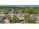 This aerial shot captures the neighborhood's charm and serene location, surrounded by lush trees and tranquil atmosphere at 2001 Pinellas Point S Dr, St Petersburg, FL 33712