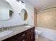 Bathroom features a double vanity with granite countertops, and a shower/tub combo at 2001 Pinellas Point S Dr, St Petersburg, FL 33712