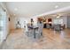 Open concept dining area featuring tile flooring, natural light, and seamless connection to the kitchen and living room at 2001 Pinellas Point S Dr, St Petersburg, FL 33712