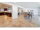 View of open floorplan with dining area, kitchen with island, and living room at 2001 Pinellas Point S Dr, St Petersburg, FL 33712