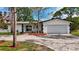 Charming single Gathering home featuring a paver driveway and a well-manicured front yard at 2001 Pinellas Point S Dr, St Petersburg, FL 33712