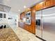 Kitchen showcases stainless steel appliances, granite counters, and wood cabinets, with a breakfast bar at 2001 Pinellas Point S Dr, St Petersburg, FL 33712