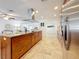 Kitchen island with granite countertops, stainless steel hood, and wooden cabinets offer plenty of storage at 2001 Pinellas Point S Dr, St Petersburg, FL 33712