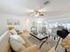 Bright living room featuring tile floors, comfortable seating, and an open layout perfect for entertaining at 2001 Pinellas Point S Dr, St Petersburg, FL 33712