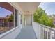 Balcony view with white railings and trees on a sunny day at 2071 Australia W Way # 59, Clearwater, FL 33763