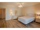 Inviting bedroom features laminate flooring, ceiling fan, and a dresser and nightstand set at 2071 Australia W Way # 59, Clearwater, FL 33763