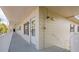 Exterior hallway with unit doors and stairs in a condo community at 2071 Australia W Way # 59, Clearwater, FL 33763