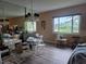 Bright living room featuring large windows that provide natural light and views of the outdoors at 2071 Australia W Way # 59, Clearwater, FL 33763