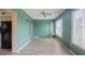 Large open living area with plenty of room, complemented by a ceiling fan and sliding glass doors at 2071 Australia W Way # 59, Clearwater, FL 33763
